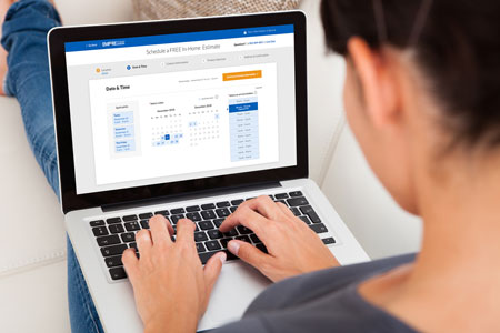 woman using laptop to get new floors