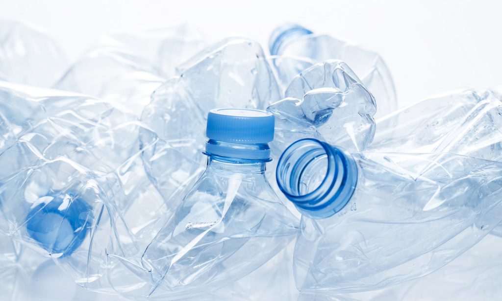 crushed plastic water bottles which can become the raw material for eco-friendly carpet