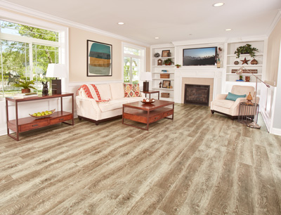 Vinyl combines the appealing look of wood, stone or tile in your living room or family room space with a more comfortable feel and an affordable price